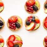 An assortment of fruit on top of crackers