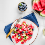 Choped watermelon, feta, and blueberries on a plate