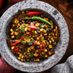 Black beans, corn, and tomato chili in a bowl.