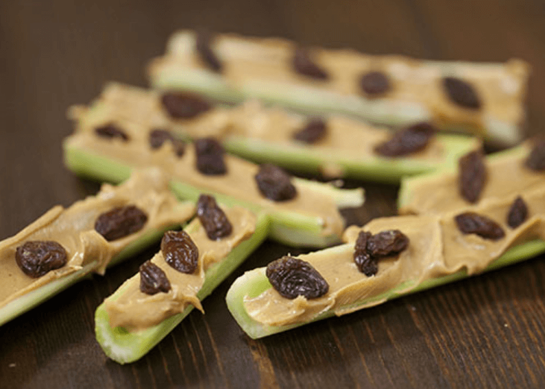 Celery sticks with peanut butter and raisins.