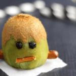 Kiwi with raisin eyes and pretzel mouth.