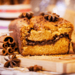 loaf of applesauce cake with cinnamon sticks