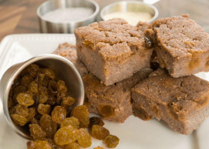 Blue corn bread slices along side of raisins