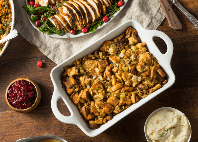 Stuffing in a baking dish with mashed potatoes