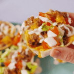 Mini tortilla tacos with ground beef, tomatoes, lettuce