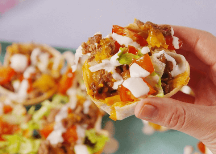 Mini tortilla tacos with ground beef, tomatoes, lettuce