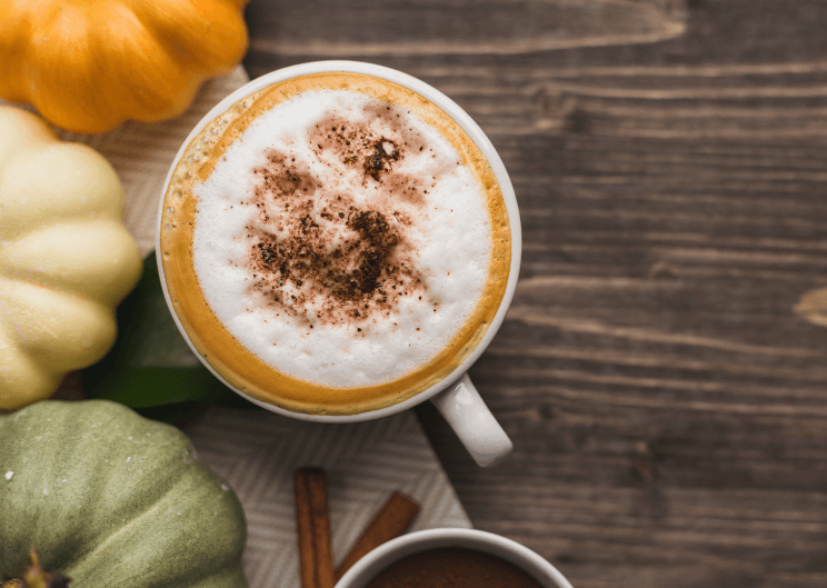 pumpkin spice latte in a mug with cinnamon on top