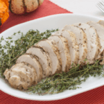 sliced turkey breast with fresh herbs