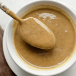 Walnut butter in a bowl with a spoon