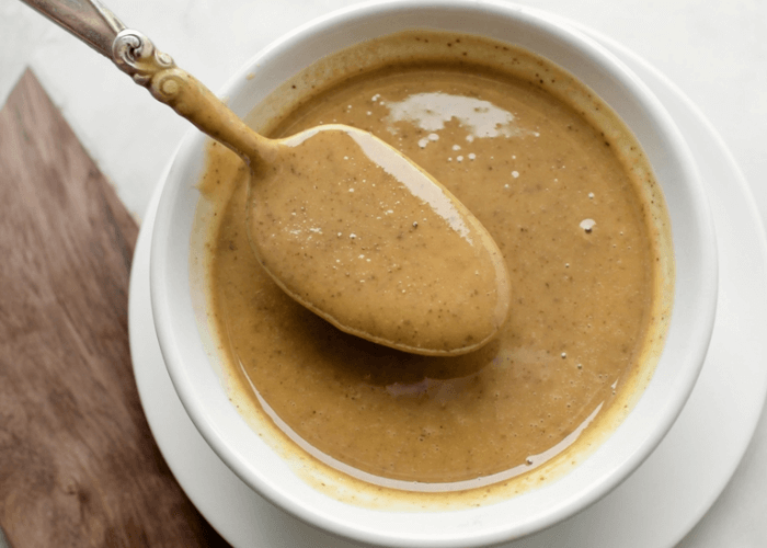 Walnut butter in a bowl with a spoon