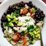 black beans, quinoa bowl with cilantro and avocado