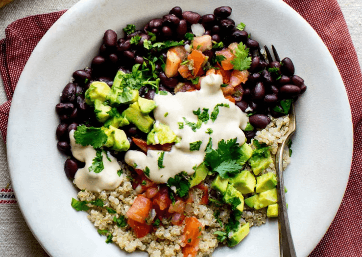 black beans, quinoa bowl with cilantro and avocado