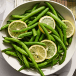 Steamed green beans with sliced lemons