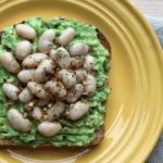 Toast with avocado, white beans, and crushed red pepper