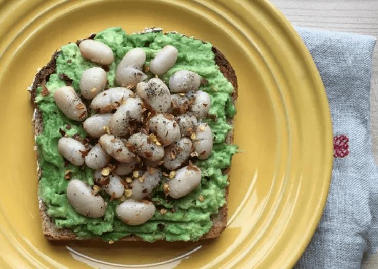 Toast with avocado, white beans, and crushed red pepper