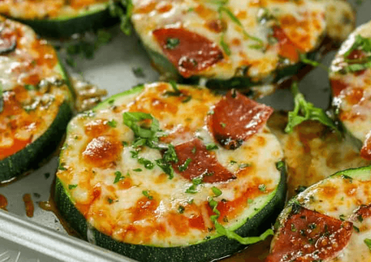 Sliced zucchini bites with pizza sauce and pepperoni