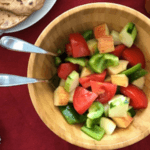 Summer salad with chopped peppers, tomatoes, cucumbers, and apples