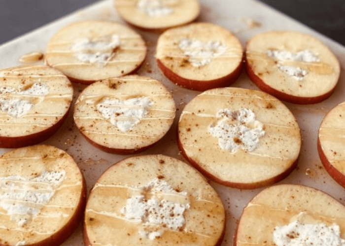 sliced apples with goat cheese and drizzled honey