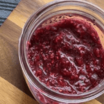 Homemade raspberry jam in a mason jar