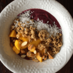 Acai smoothie bowl with granola, ginger, mango