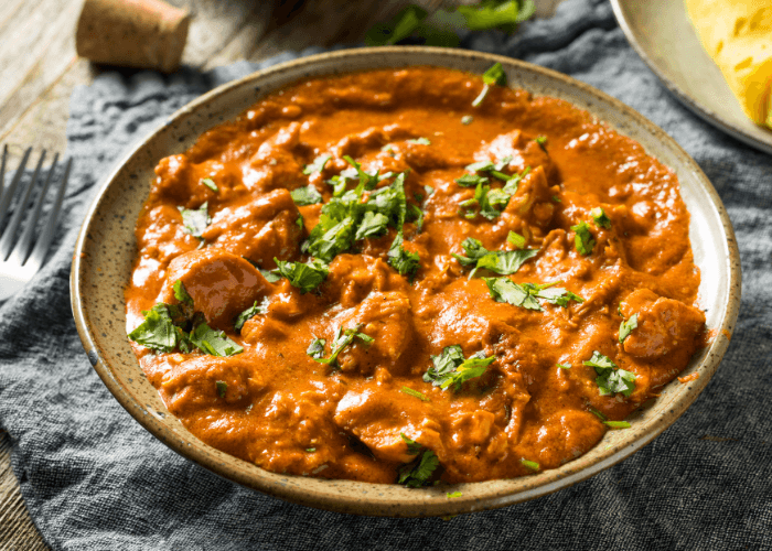 Moambe Chicken Stew with fresh herbs