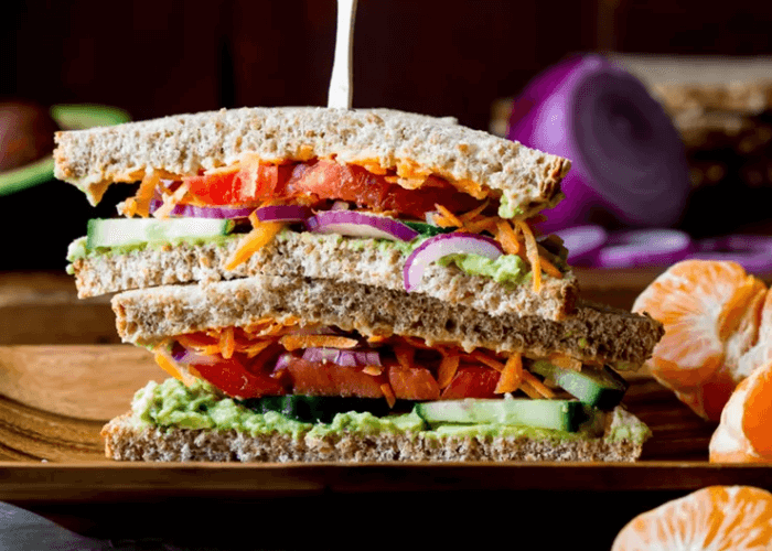 Vegan Veggie Sandwich with sprouts, lettuce, carrots, tomato
