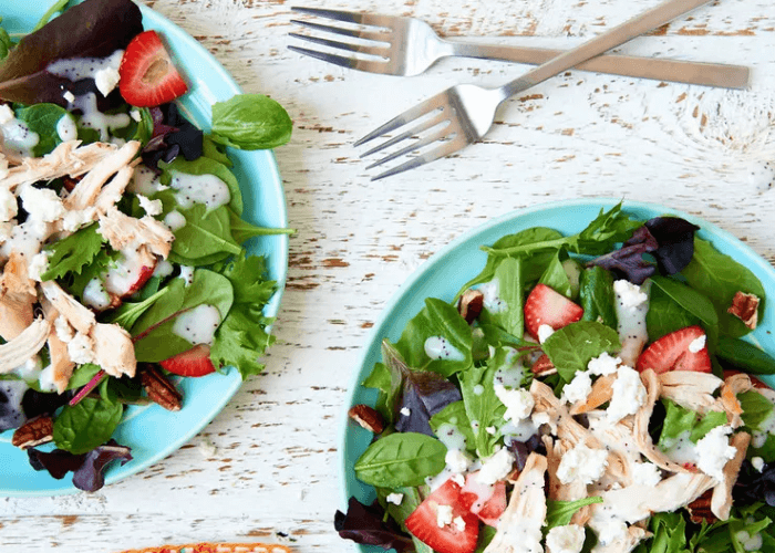 Greens, chicken, strawberries, with poppy seed dressing