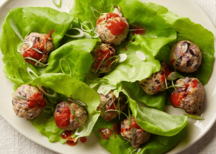 Pork and scallion meatballs with leafy greens