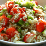 Quinoa salad with cucumber, bell pepper, tomatoes, feta, carrots