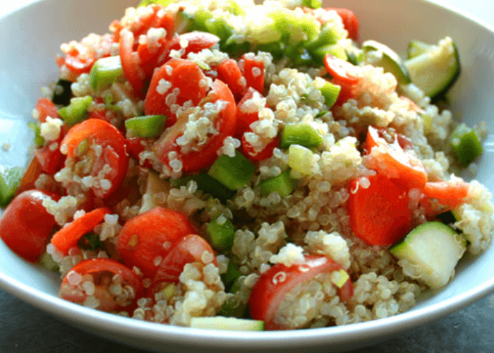 Quinoa salad with cucumber, bell pepper, tomatoes, feta, carrots