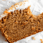 Gluten-Free Carrot Cake with frosting and a bite taken out of it