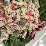 Pasta salad with greens, broccoli, red onion, diced ham
