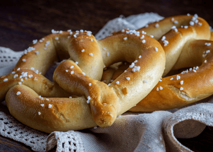 Two soft pretzels on cheese cloth