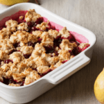 Blueberry pear crisp in a dutch oven with pear