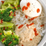 Hummus Breakfast Bowls with rice, broccoli, egg, and sriracha