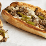 Philly Cheesesteak Sandwiches with peppers, onions, and shredded steak