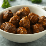Bison Meatballs stacked in a white bowl