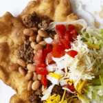 Fry Bread with beef, beans, cheese, tomatoes, onions, and lettuce