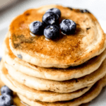 stacked pancakes with blueberries
