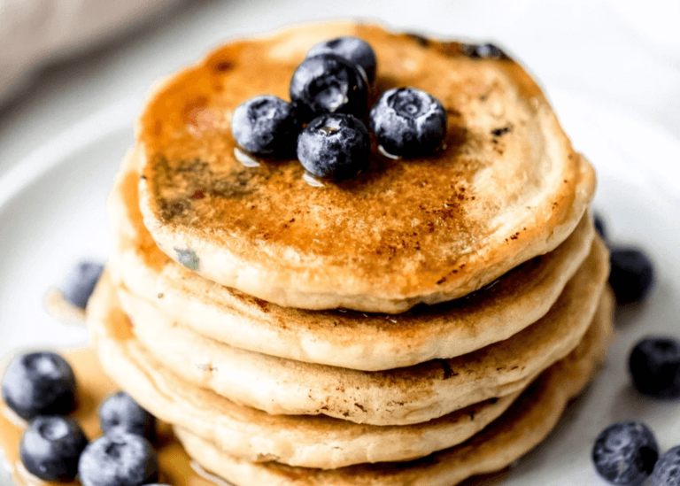 stacked pancakes with blueberries