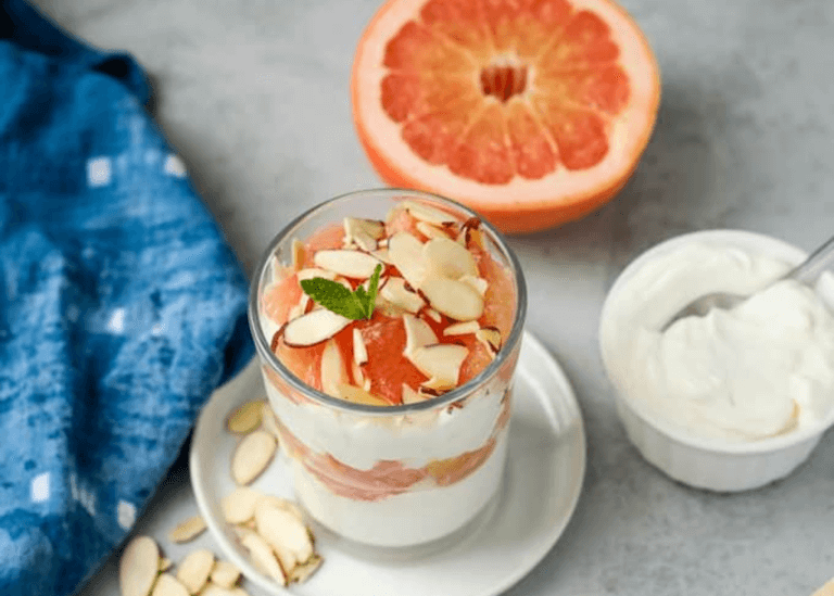 half a grapefruit next to Grapefruit Yogurt Parfait